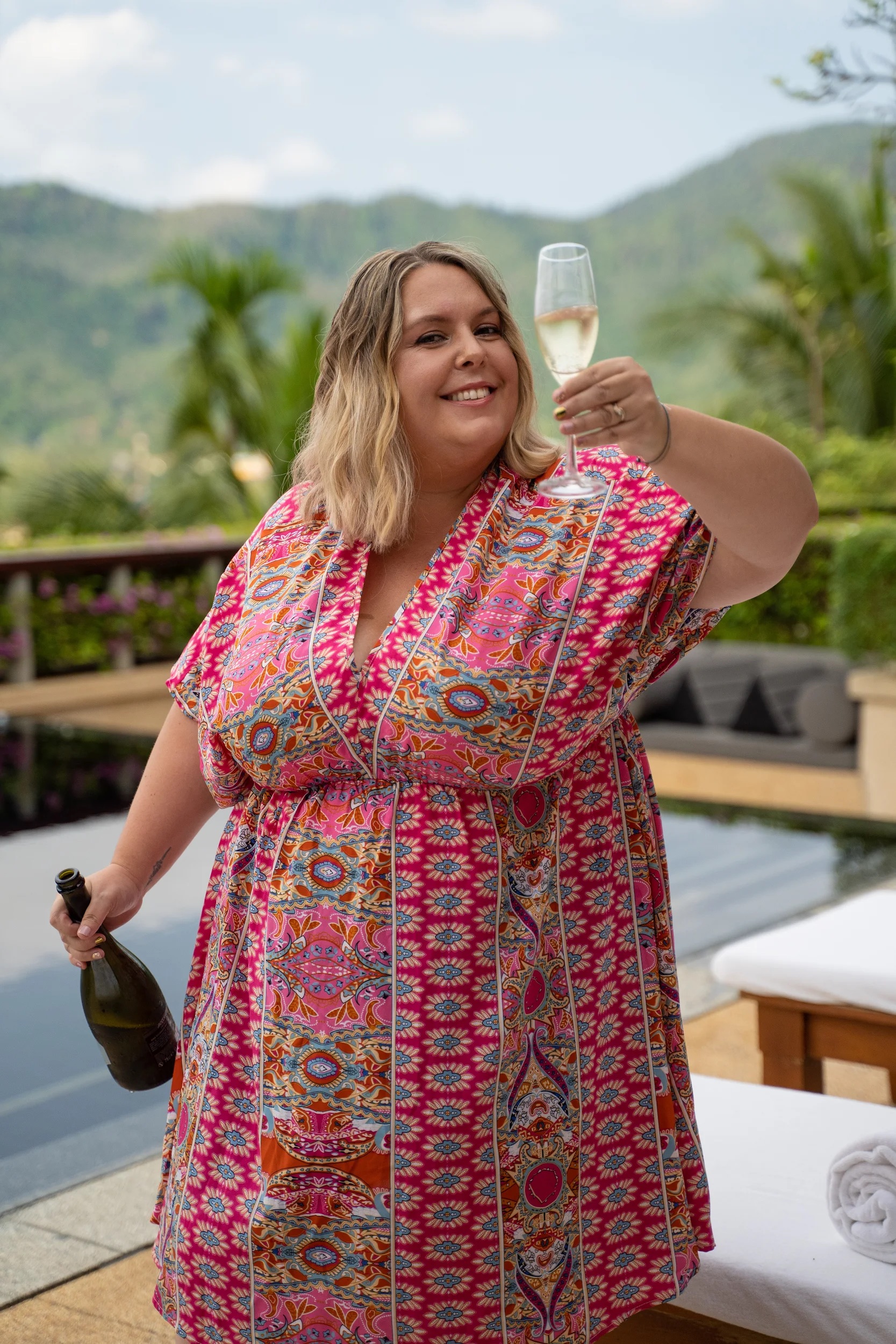Jen Ritchie laughing with a champagne toast